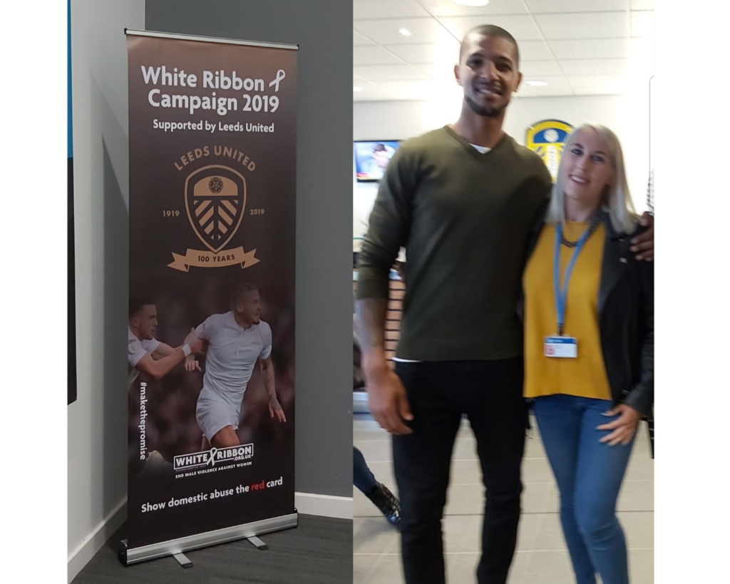 Georgia Beattie stood next to Leeds United football player. Image also shows a banner advertising white ribbon campaign 2019